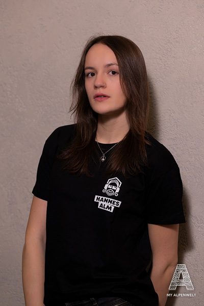 Black T-shirt with Hannes Alm logo on the left front